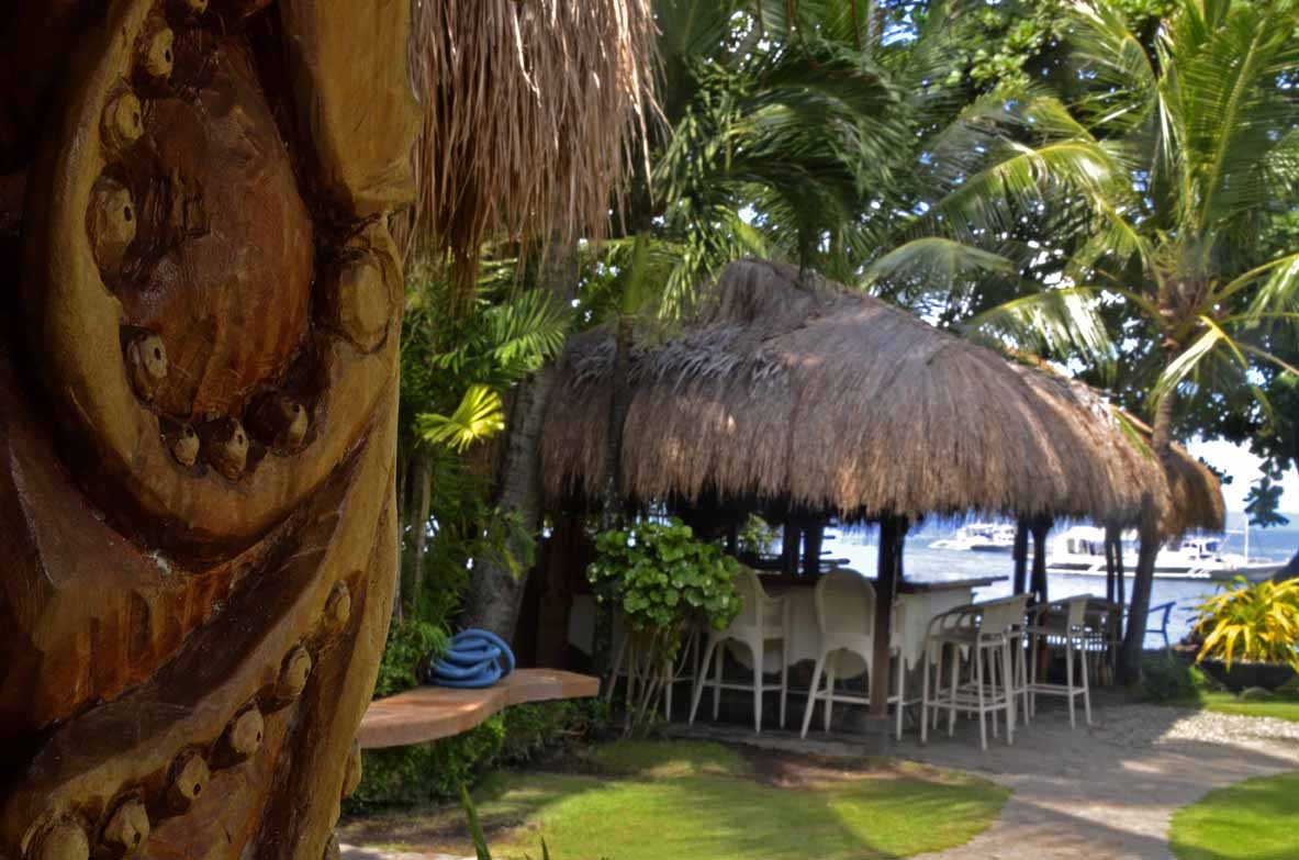 Hand-carved pillars and the Beach Bar